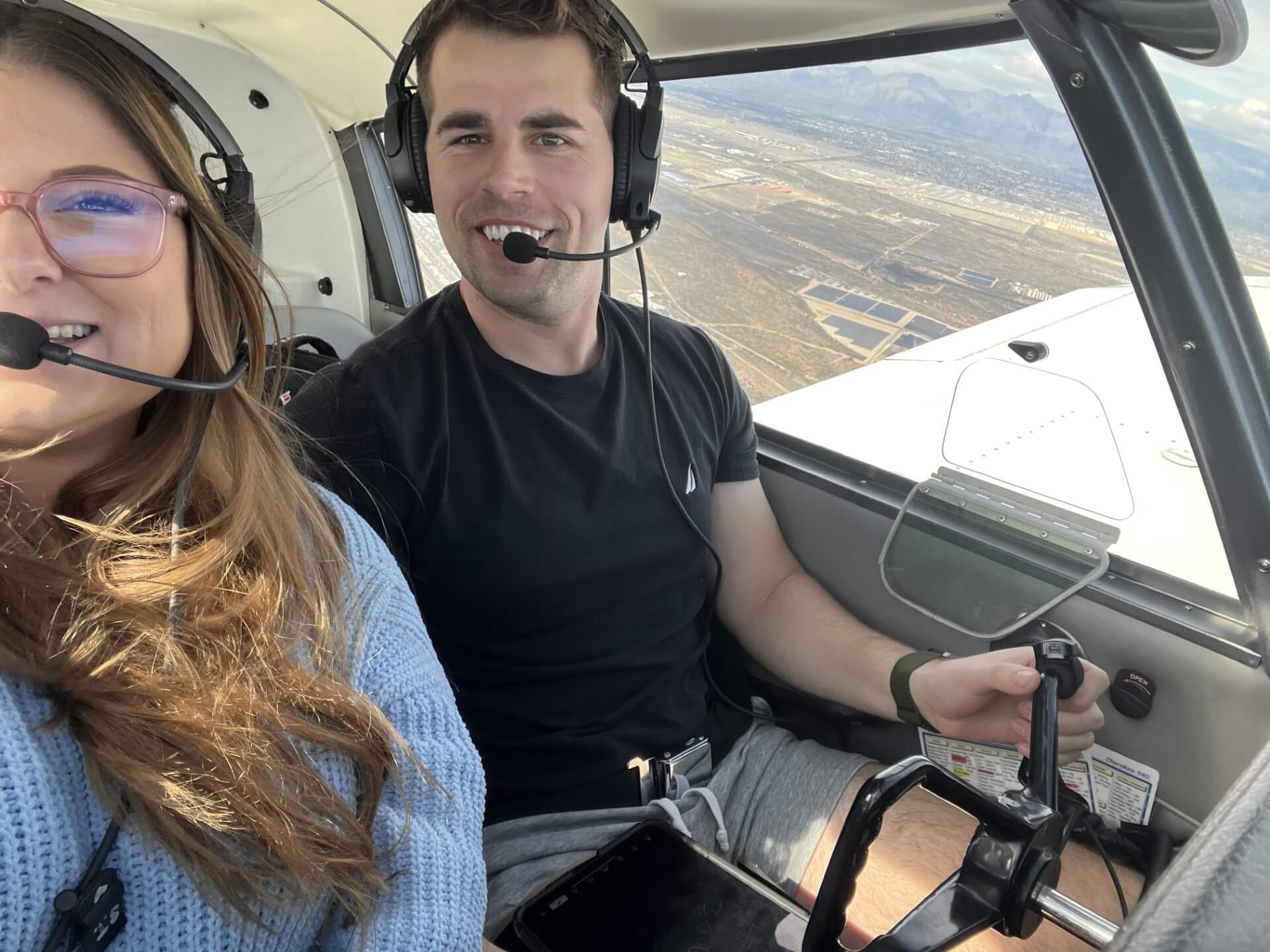 Sarah Tanis and her husband flying a plane. 